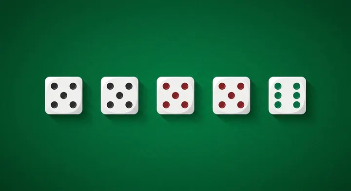 Five colored dice showing the Kismet color pairs black, red and green in Kismet